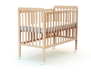 Dropside baby cot with flat slats.